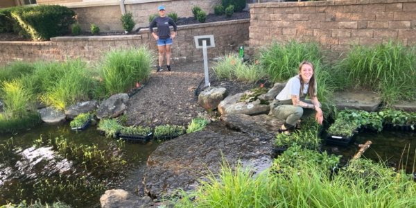Two Arkansas Conservation Corps volunteers posing with landscaping project